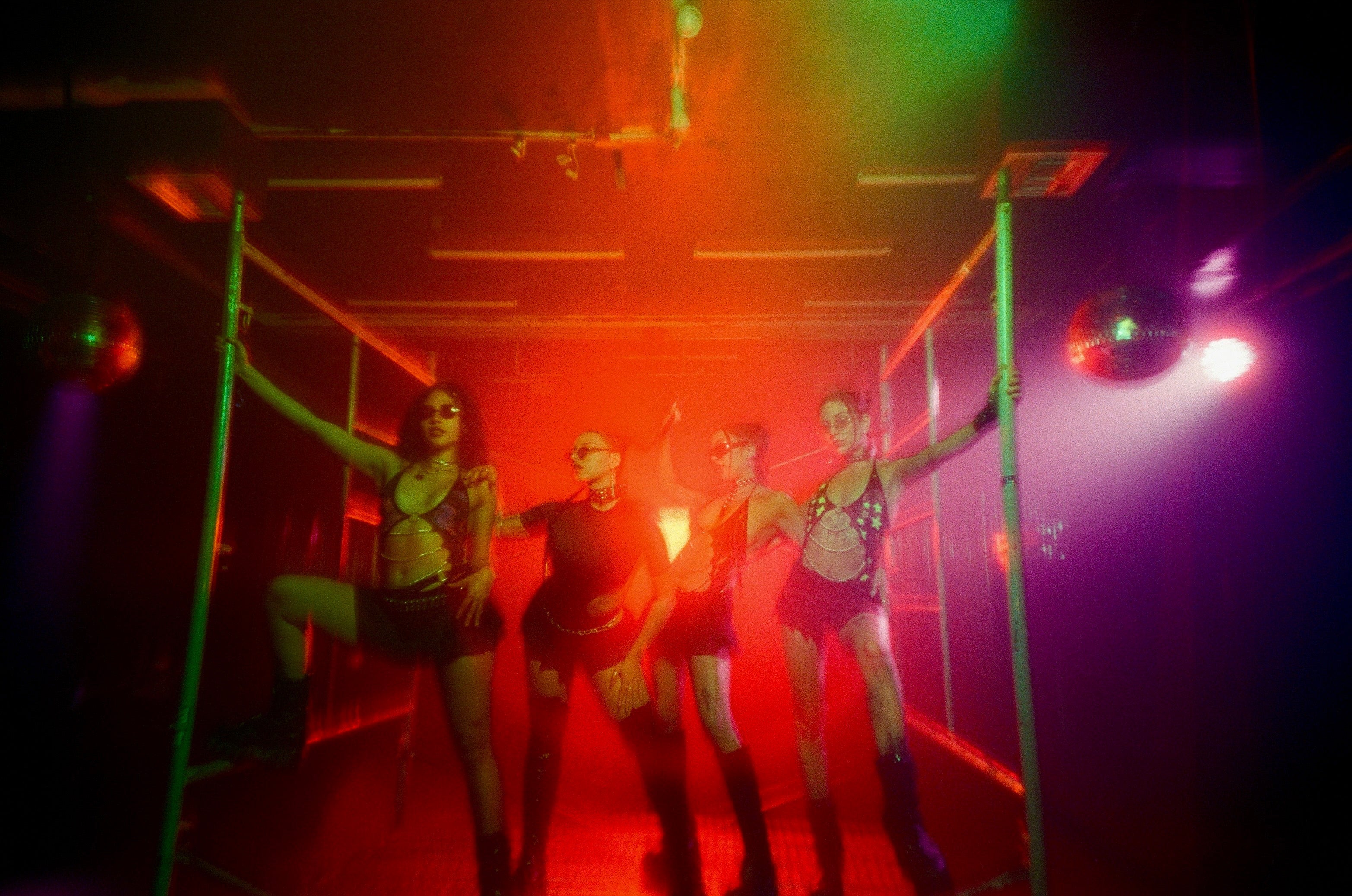 Group of girls wearing a full Mi Gente Clothing outfit in the rave